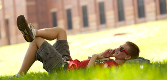 Student relaxes on the Quad