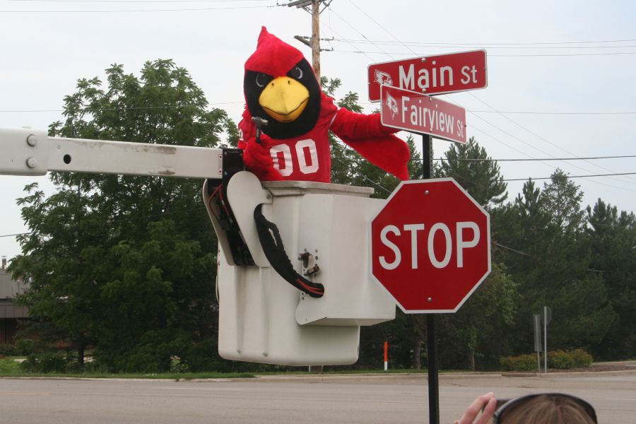 Reggie Redbird with new street signs