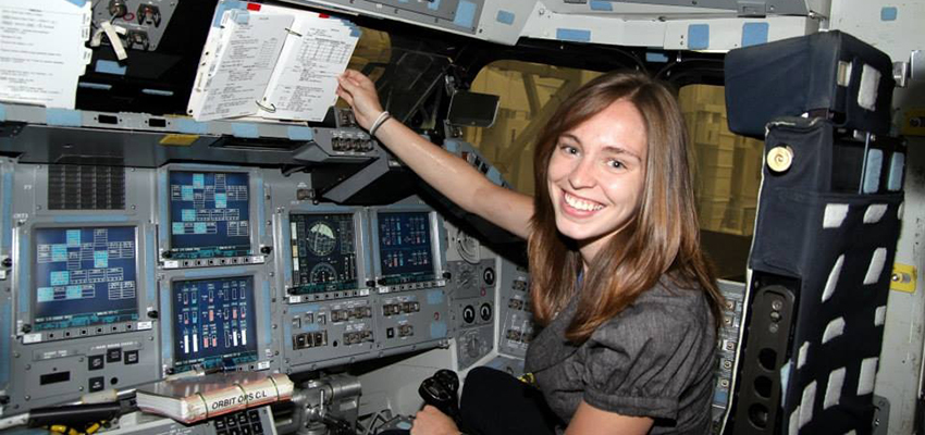 Andrea Bruck in a space shuttle mockup