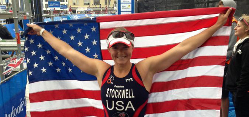 Melissa Stockwell holds a flag