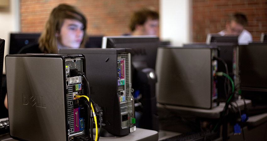 student works in a School of Informational Technology classroom