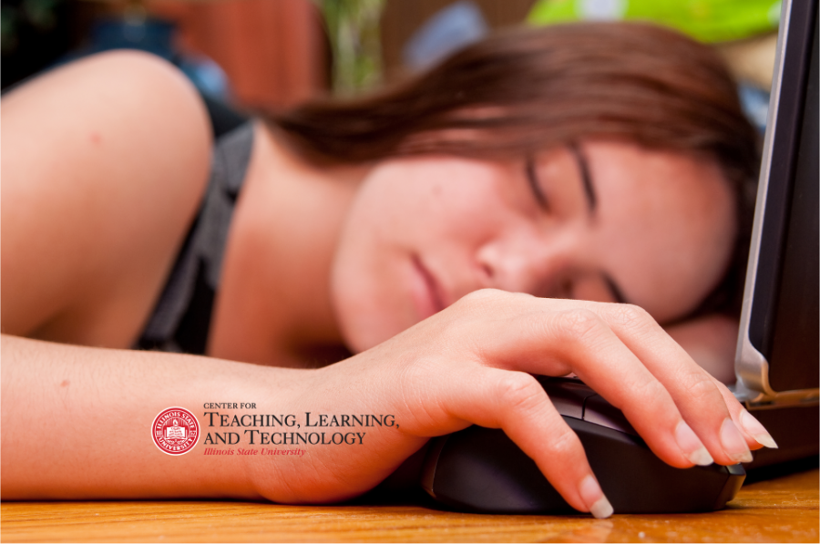 A student asleep with her hand on a mouse