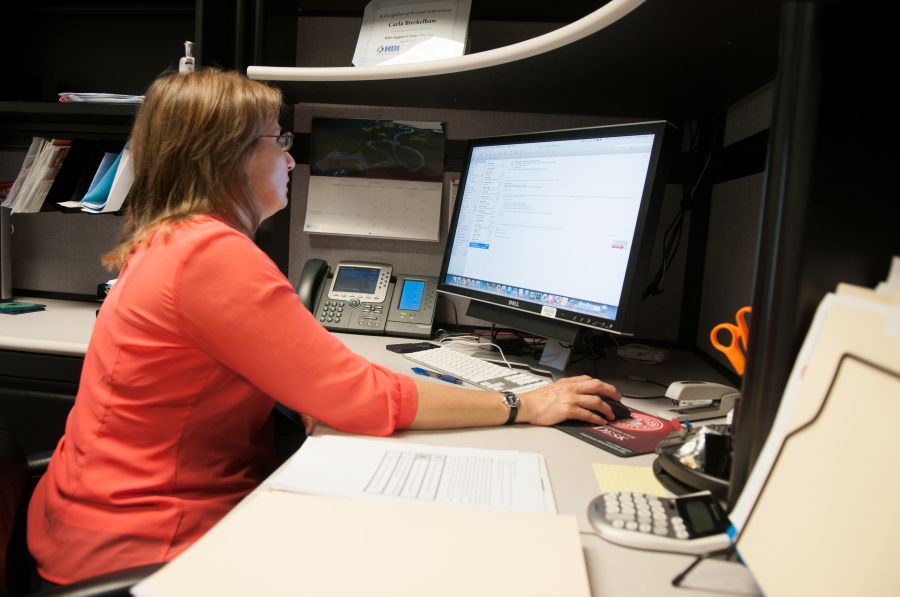 ISU employee at computer