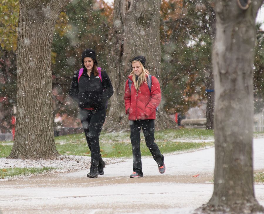 students walk through the snow