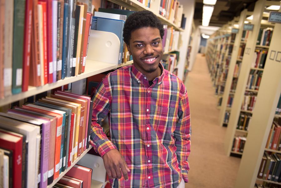 Dyrell Ashley poses in library
