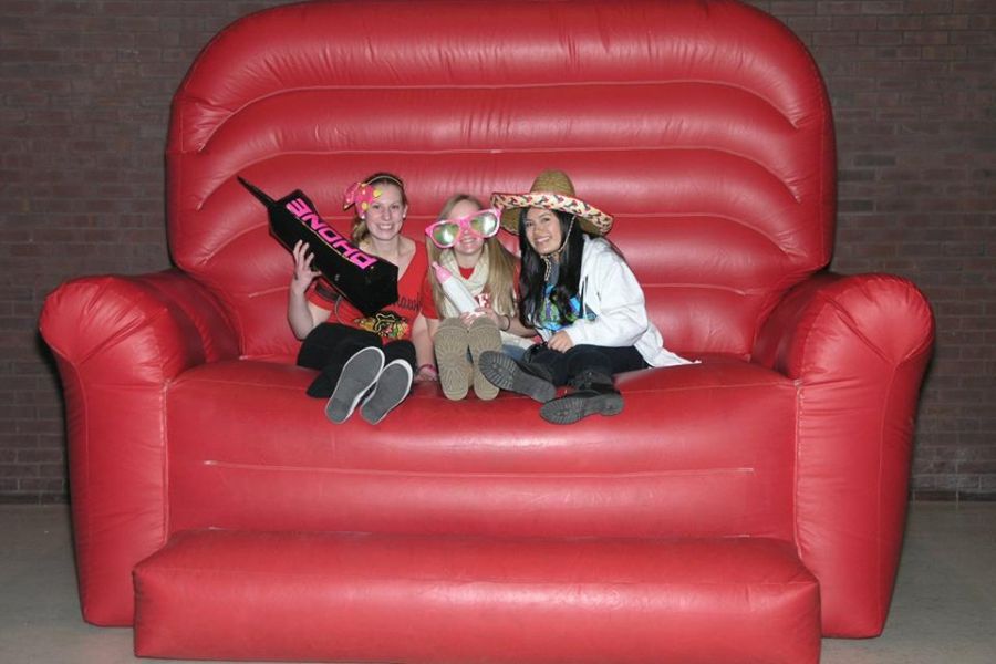 Students in a big red chair