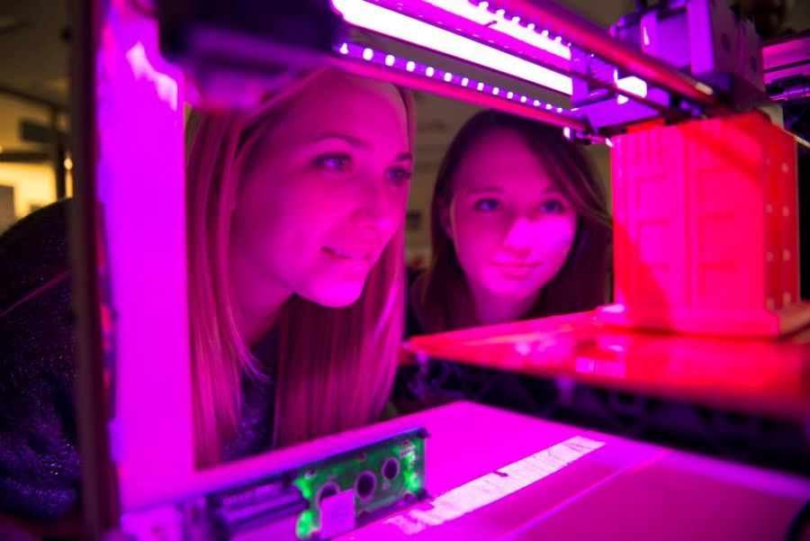 Redbird educators check out a 3-D printer at T21Con.