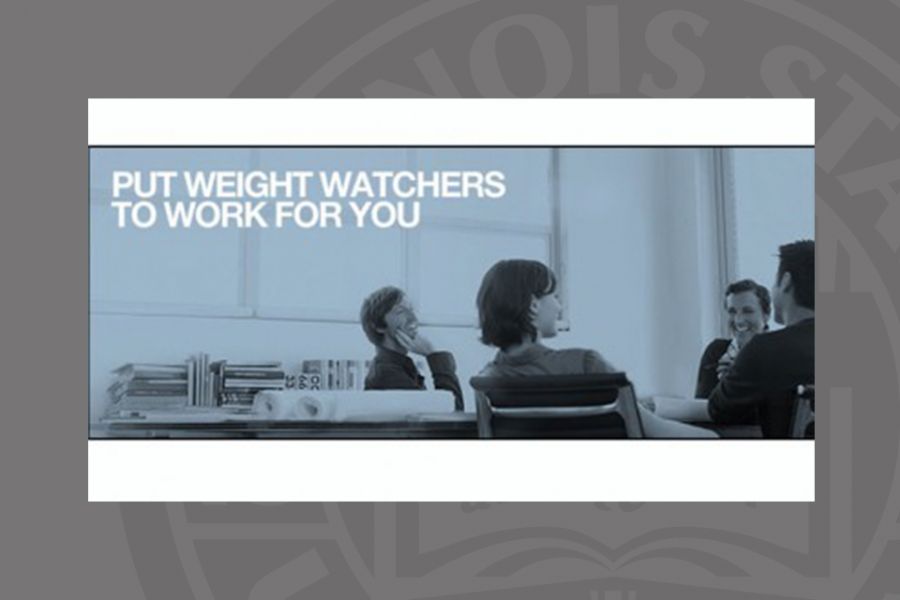 People at a desk with weight watchers in print
