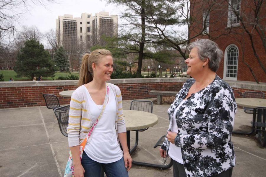 Maureen Smith (left) talks with a nontraditional prospective student about an academic career at the Illinois State College of Education.