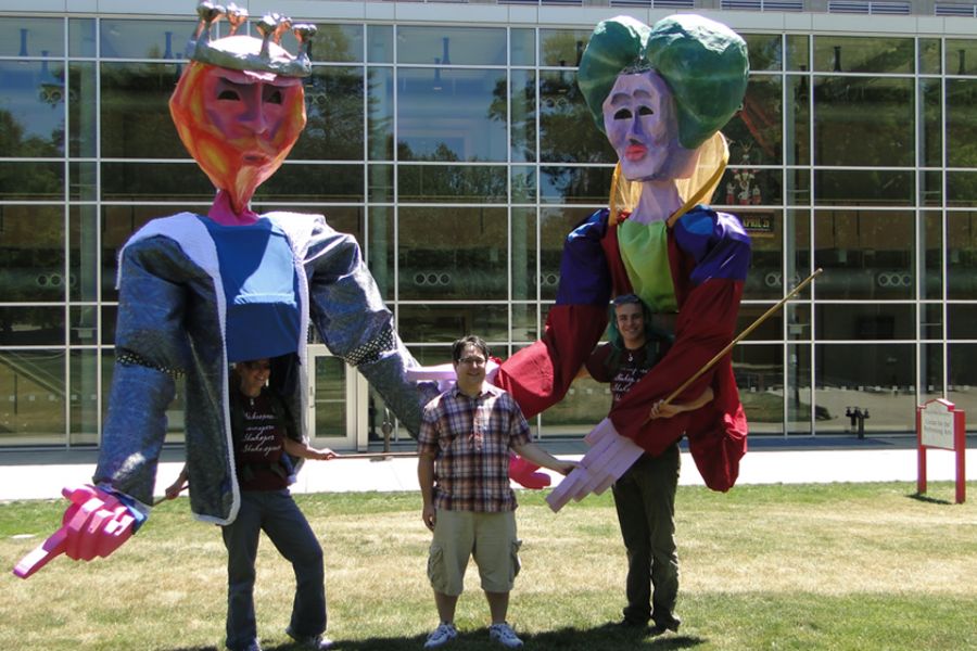 Michael Vetere and students operating 12-foot puppets