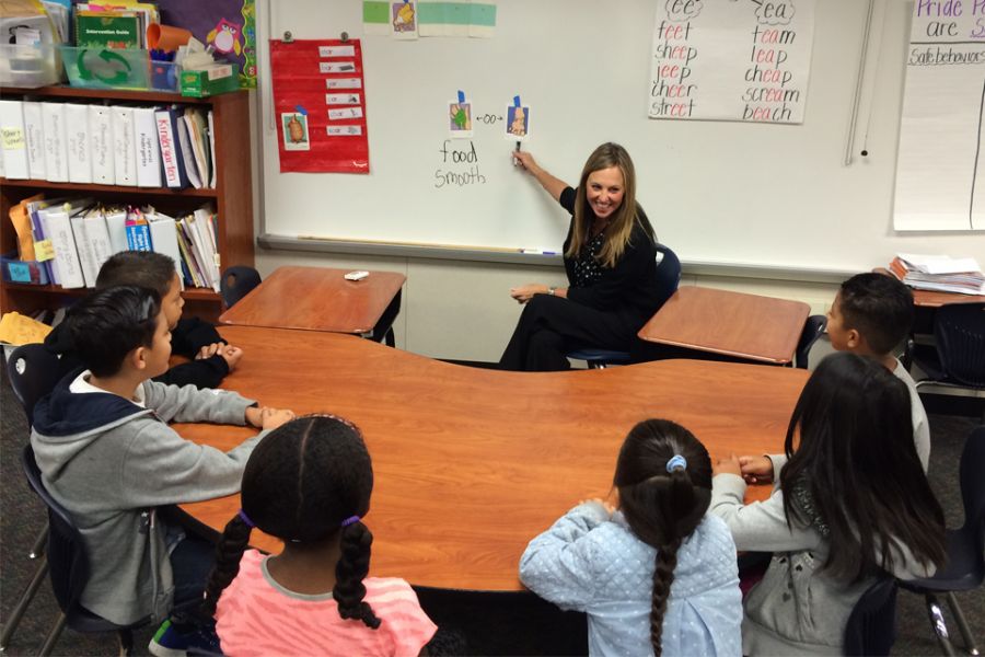 Laughlin and her students work on a reading lesson at Hansen School in Orange County.