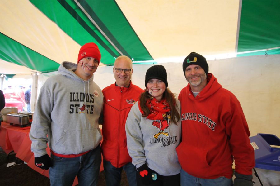 College of Education Dean, Perry L. Schoon celebrates Illinois State Homecoming in 2014 with alums Kristin and Peter RIchey, and Assistant Dean of the College of Education, Ken Fansler.