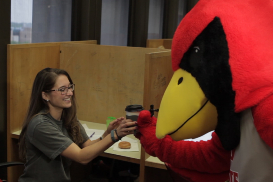 Reggie Redbird delivers coffee and donuts
