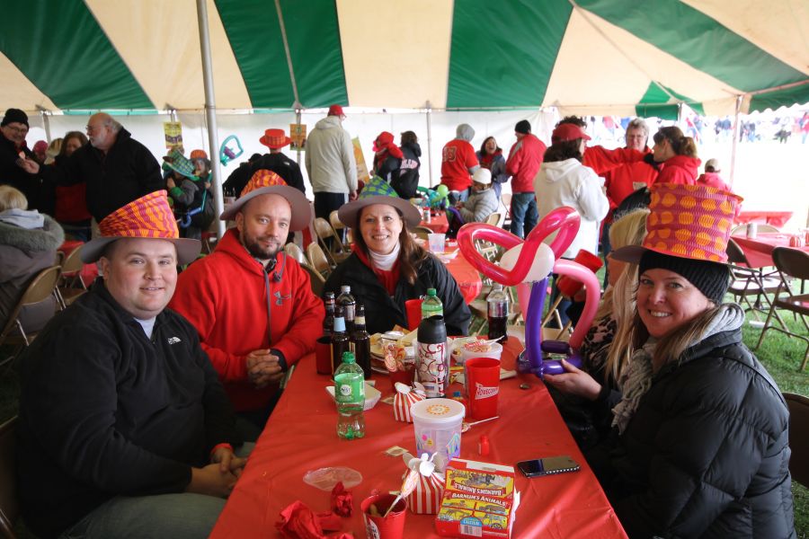 College of Education alumni, faculty, staff, and students #BackTheBirds at the College of Education's circus themed tailgate tent.