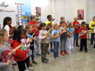 Students play El Sistema violins