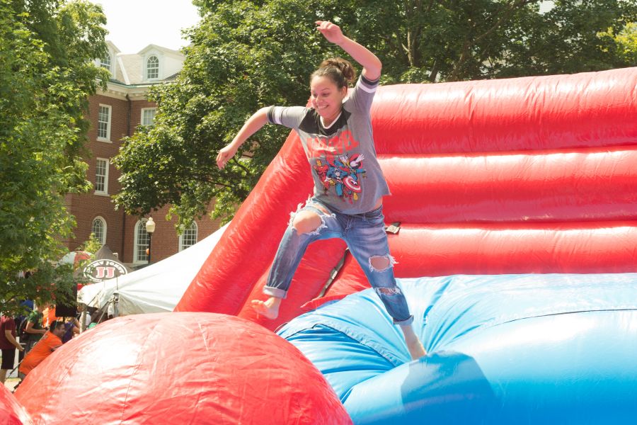 Student on inflatable game