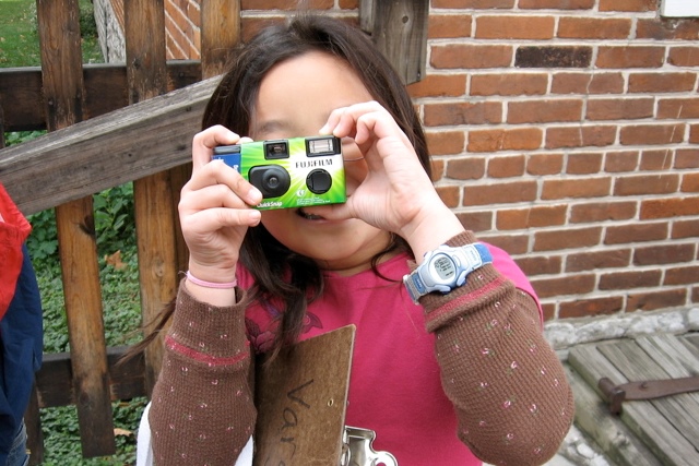 Girl using a camera to take pictures
