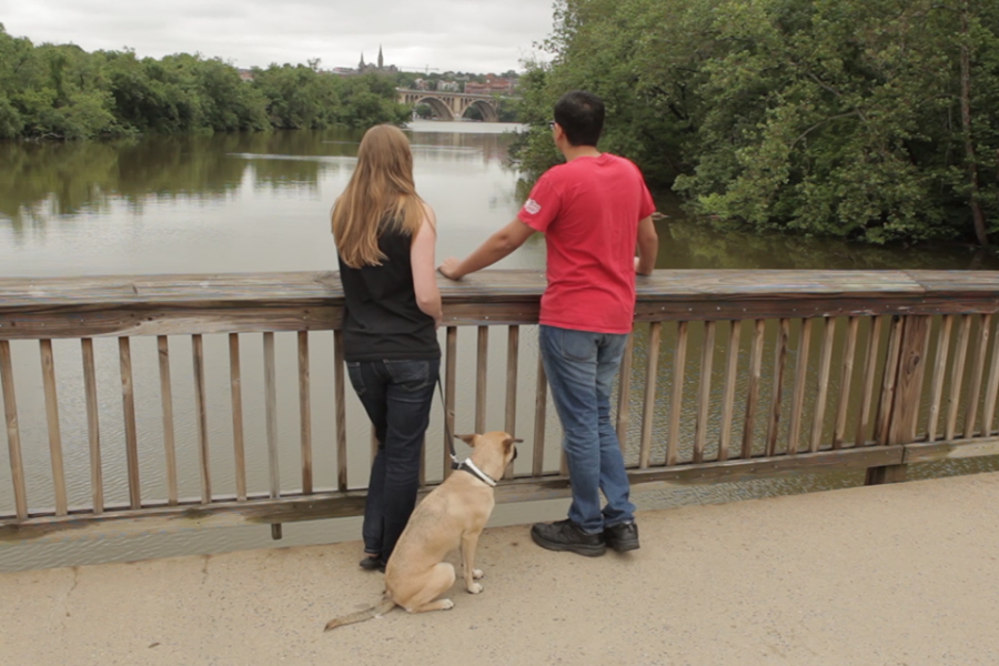 Ambuj Neupane and Katie Saunders on a walk with their dog