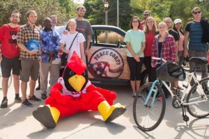 Reggie Redbird and students with Peace Corps "Peace Car"