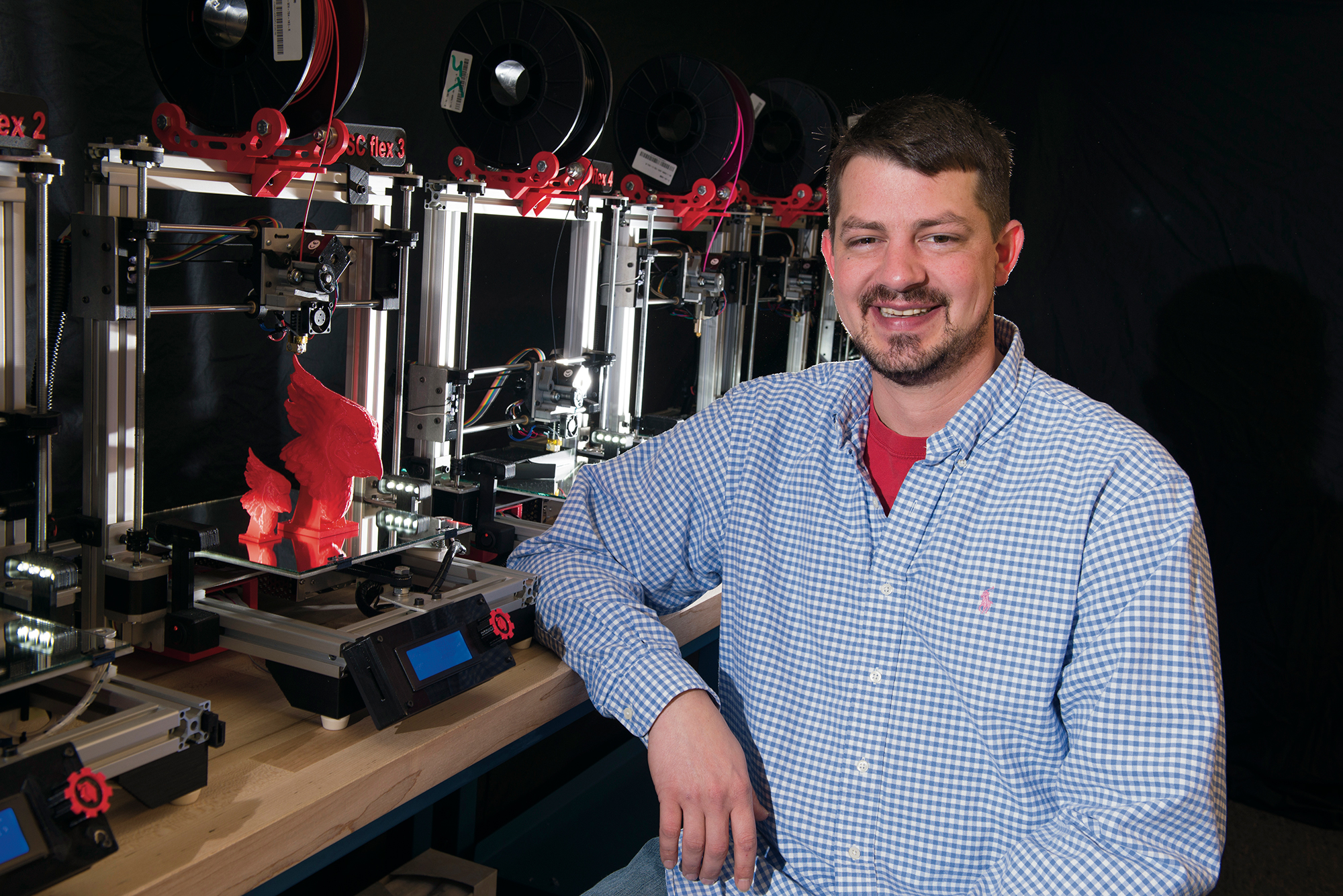 Rob Martin poses with 3-D printer