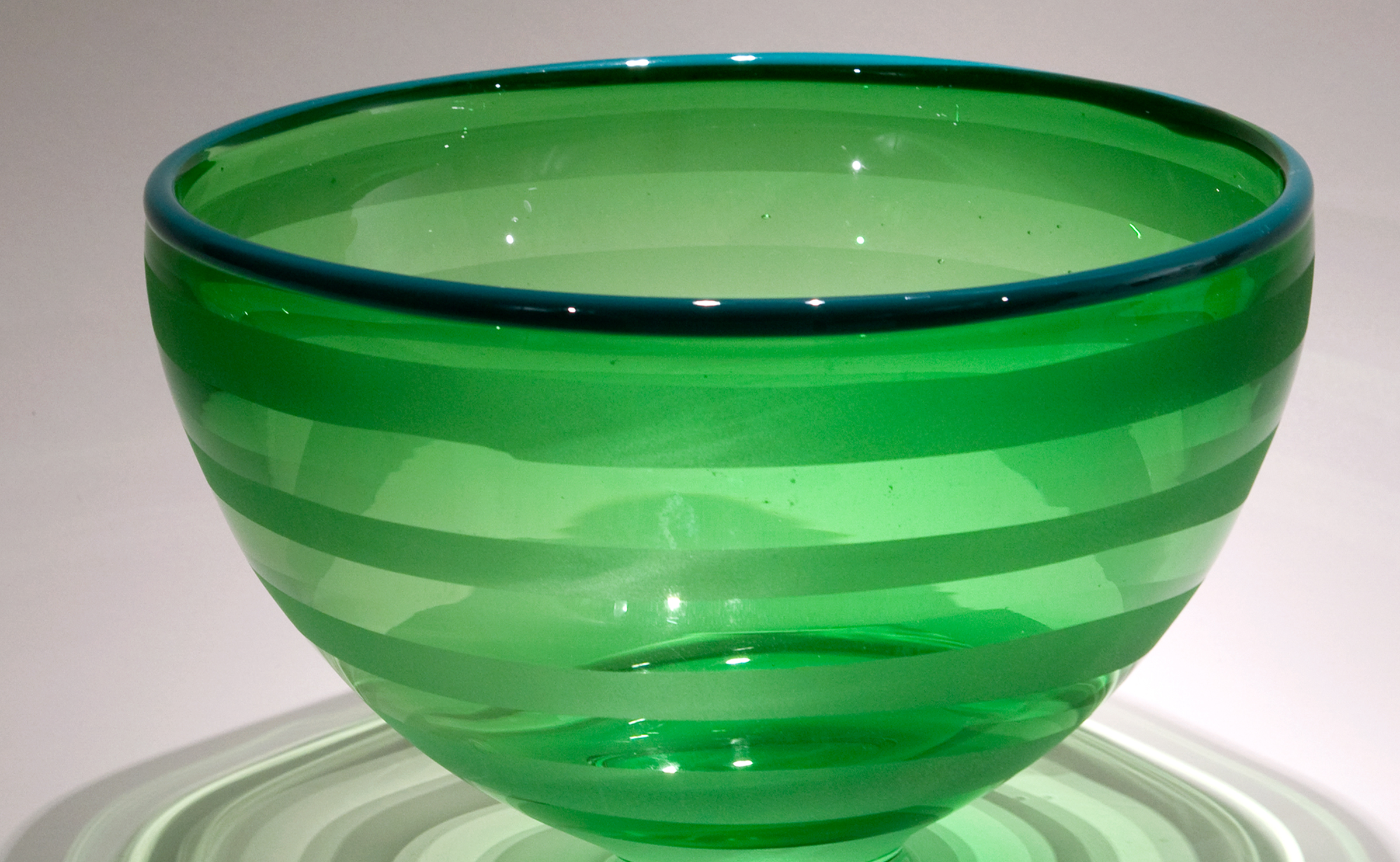 an image of a glass, green bowl from the Illinois State University Holiday Glass Sale