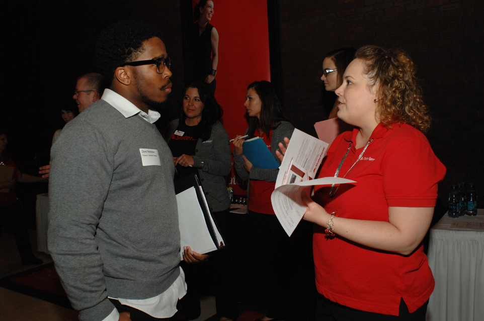 Student speaking with an employer