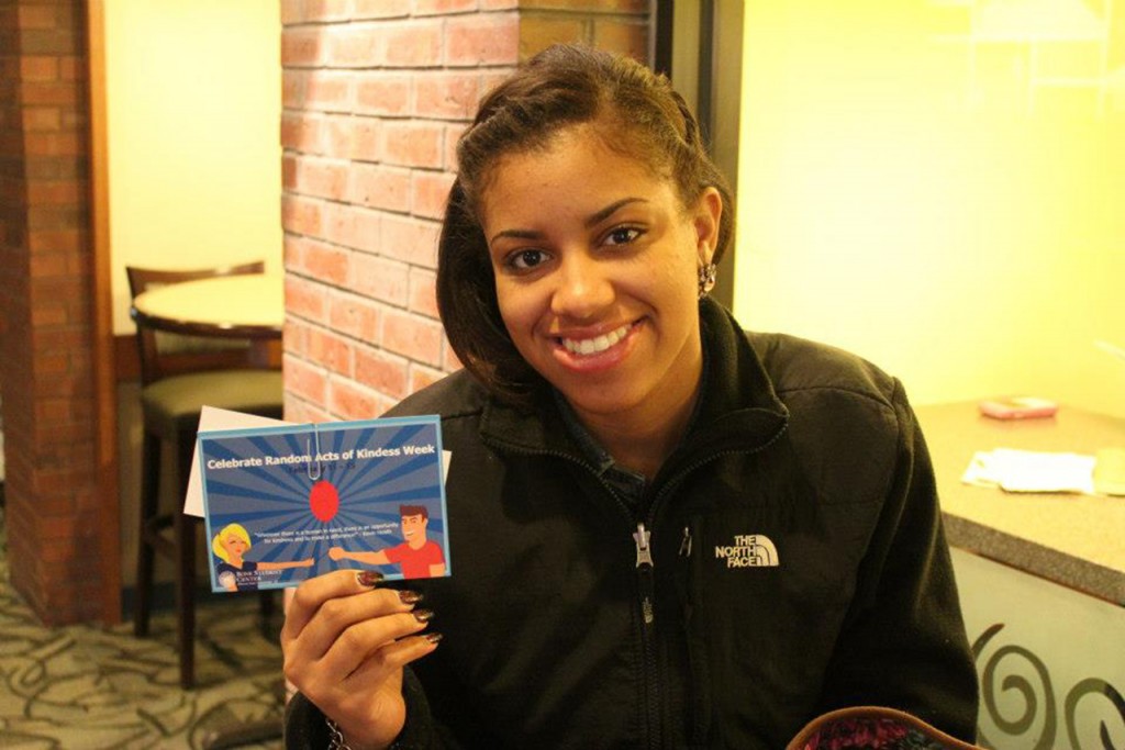 A student holding a card