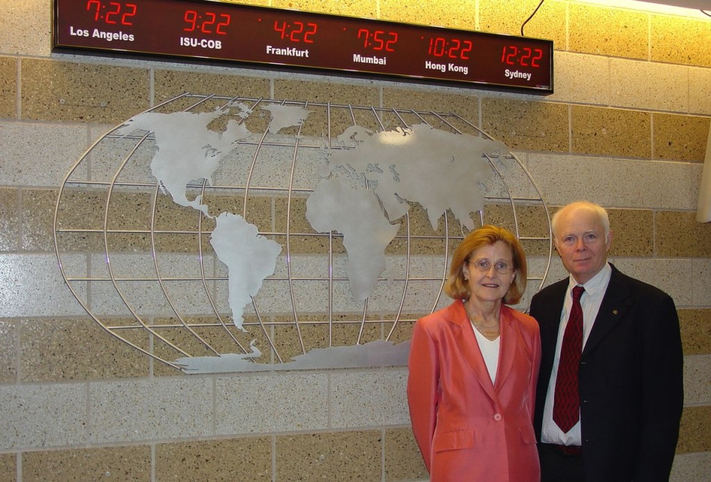 Iris and Carson Varner in front of the World Clock in the College of Business.