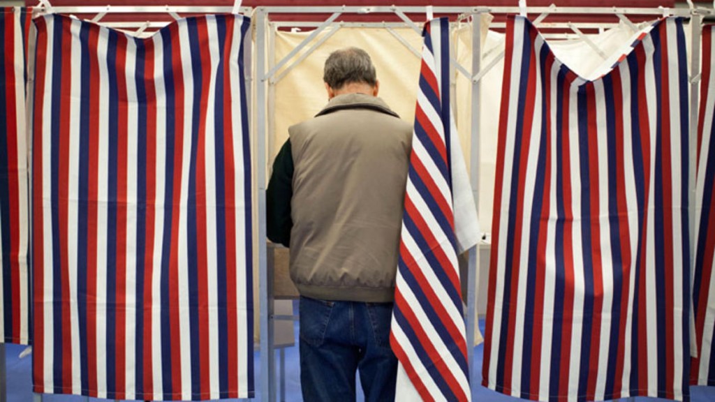 image of a man in a voting booth