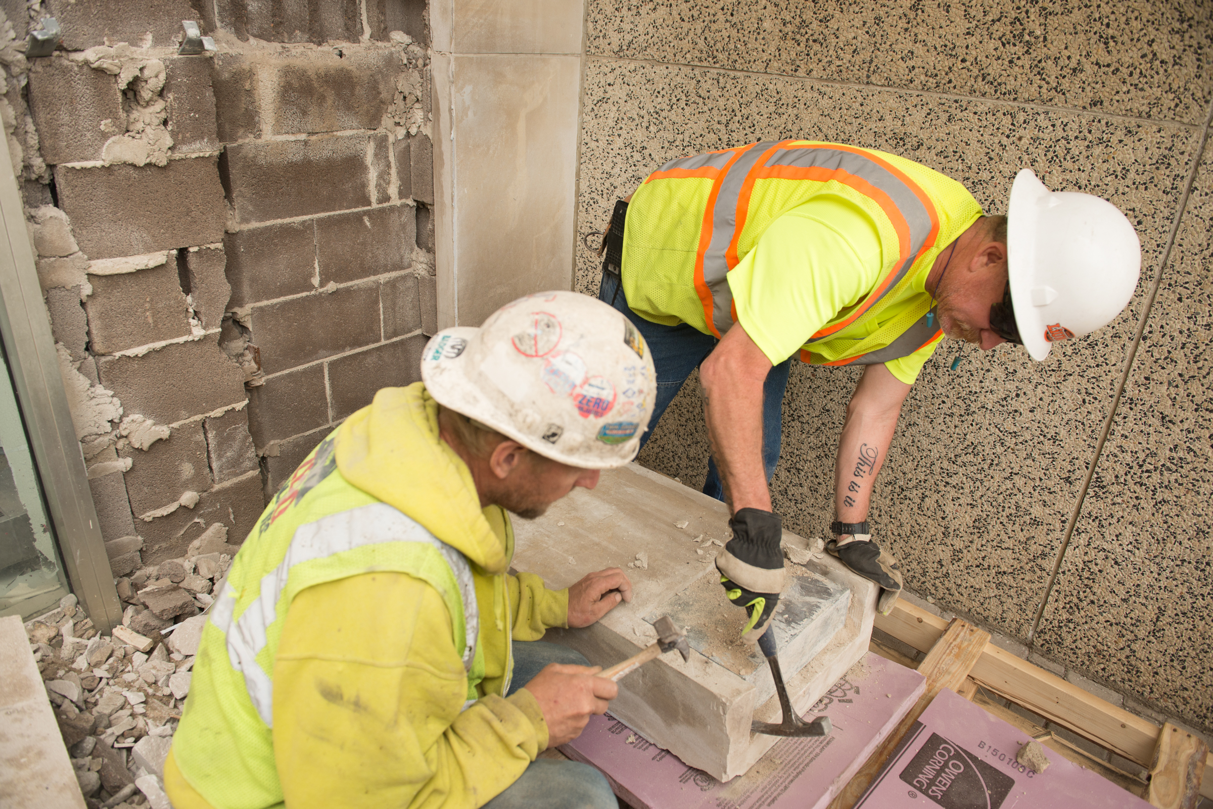 Workers remove time capsule from cornerstone