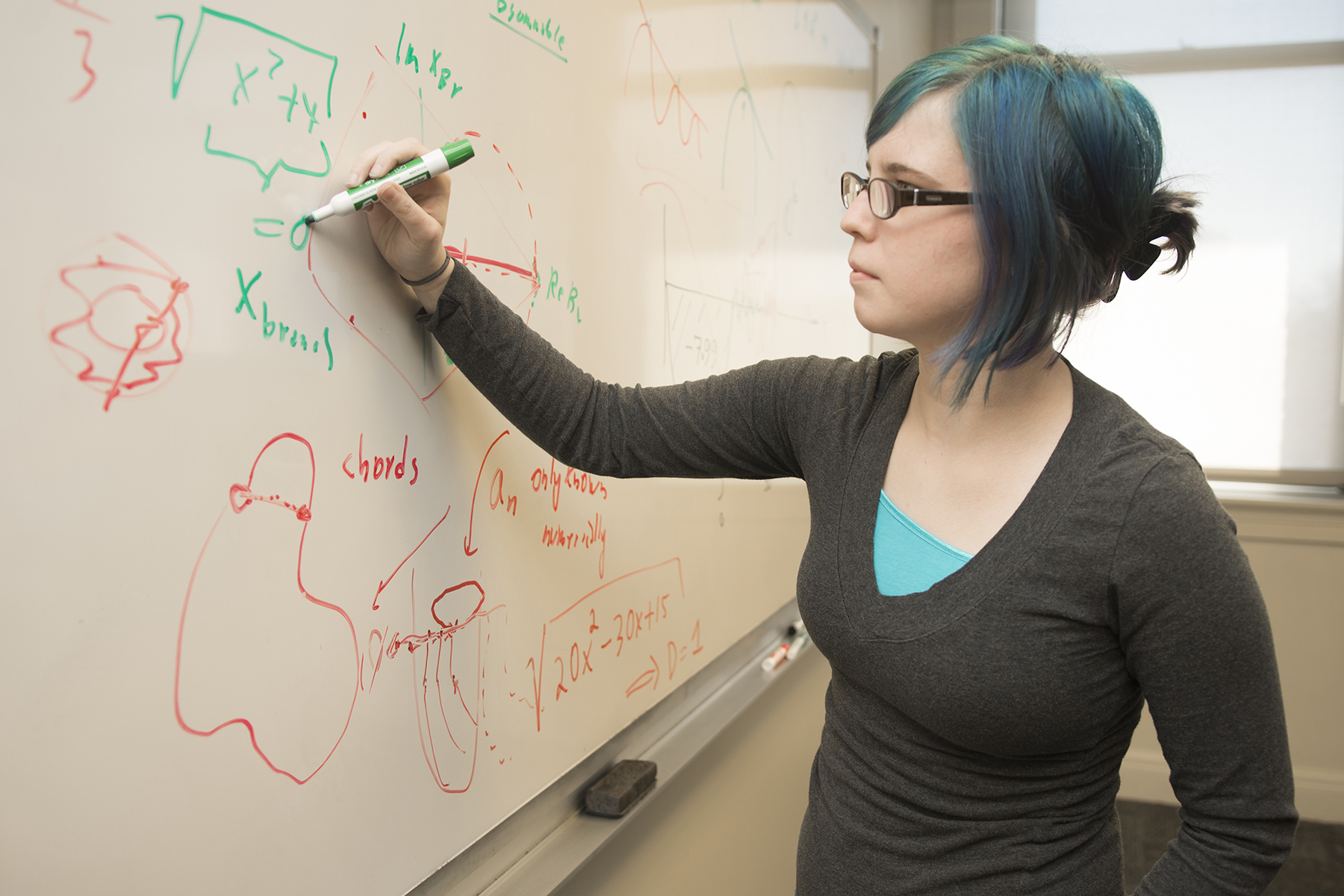 National Science Foundation Fellowship Samantha Norris writing at chalkboard