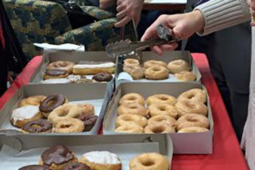 doughnuts in boxes on table