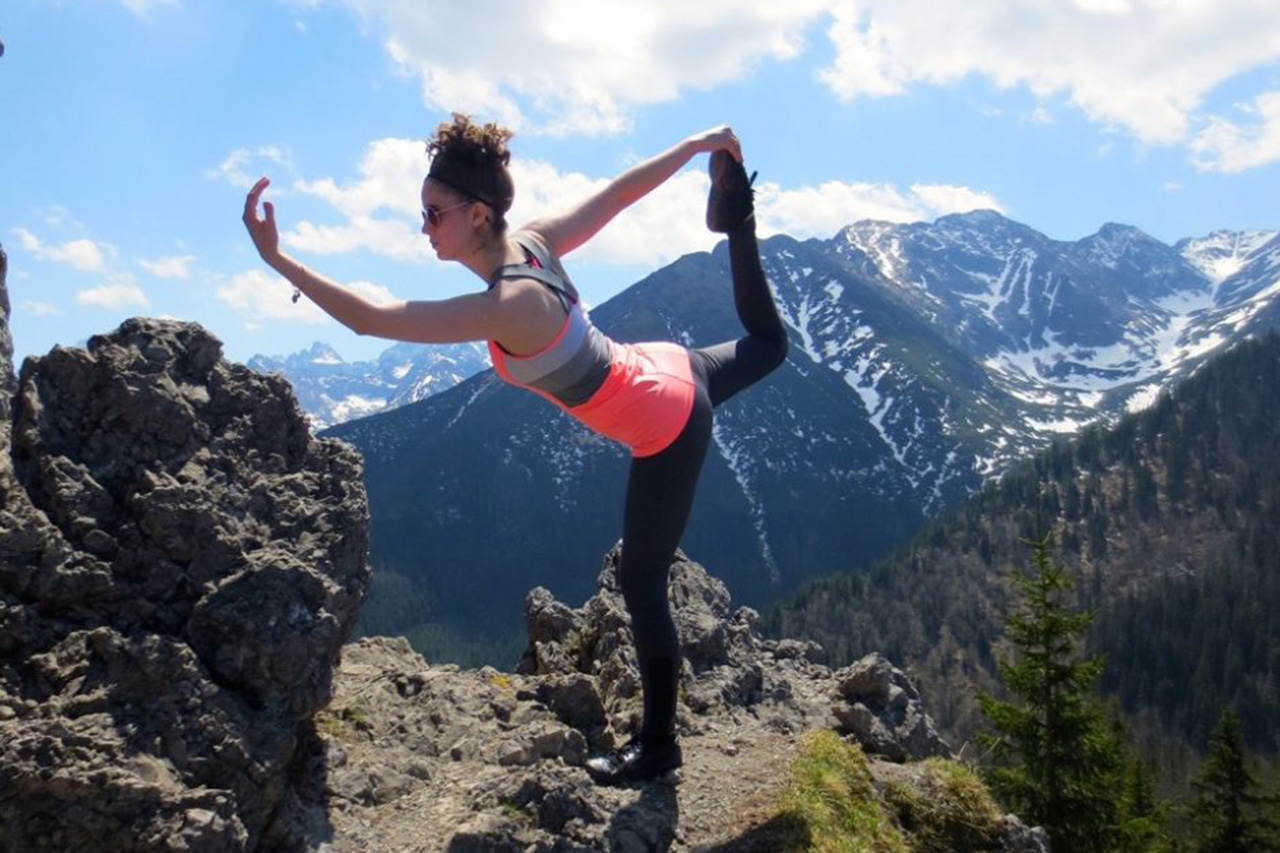 Michelle Grzybowski doing yoga move in the mountains