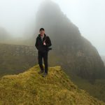 Logan Potter poses on foggy mountain