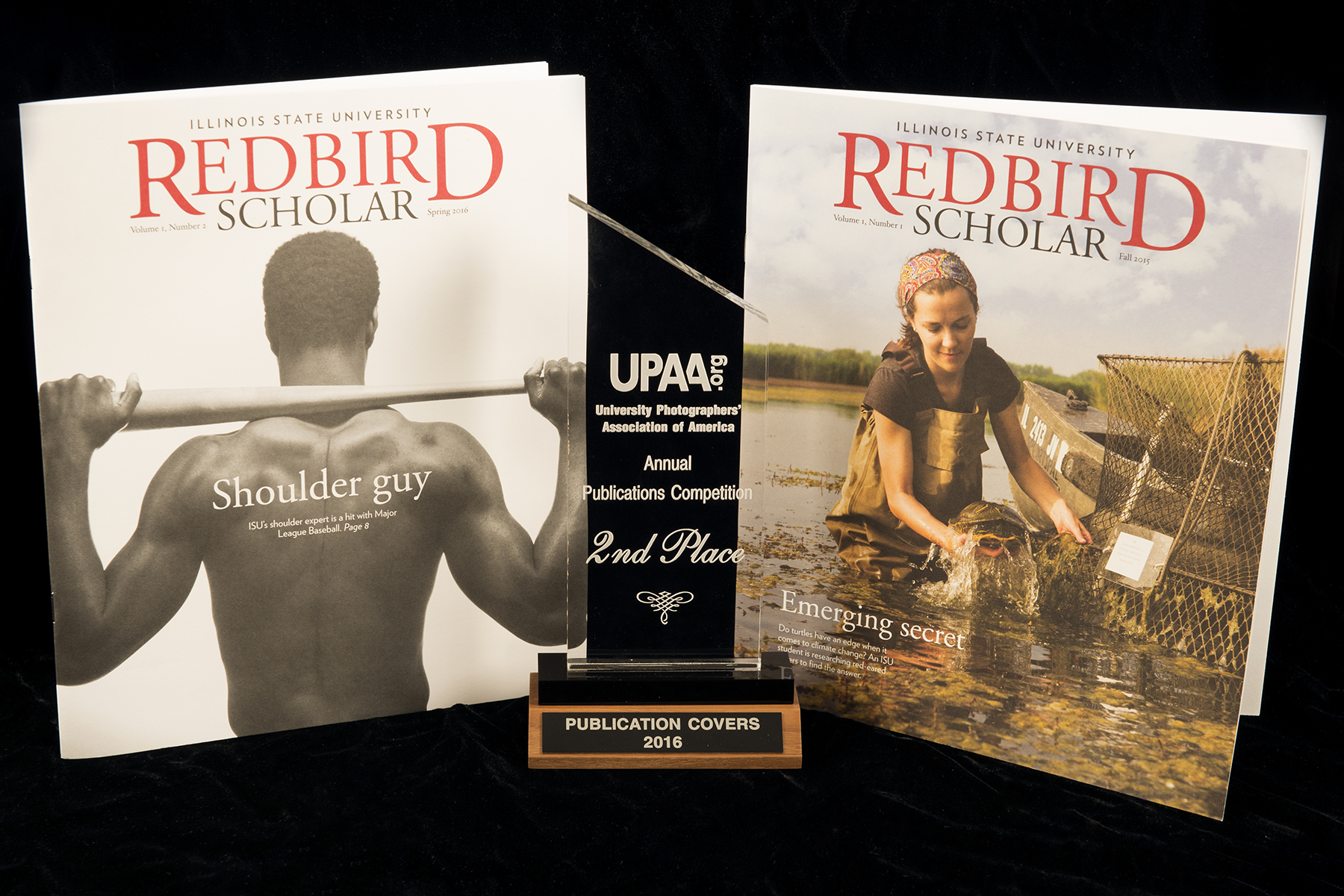 Redbird Scholar magazines with the award