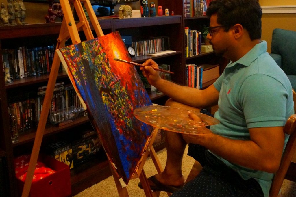 Avi Datta at work on a painting