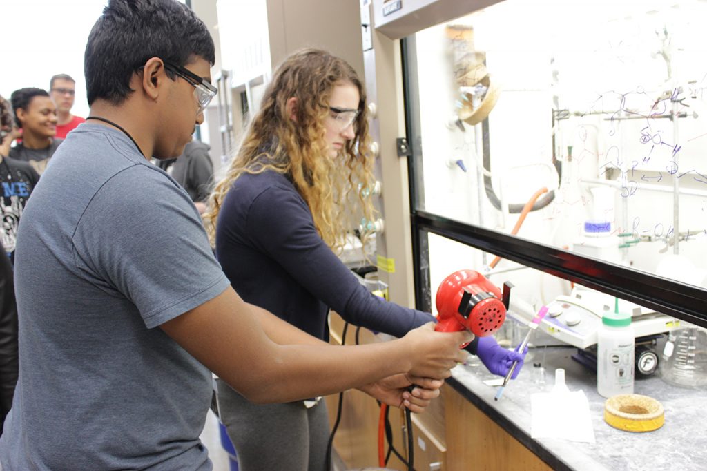 Students work in Professor Andrew Mitchell's Chemistry lab during the Summer Research Academy.