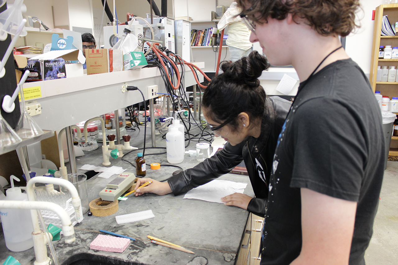 Aditi Katwala, of Conant High School, and Tom McGraw, of Normal Community High School, are conducting organic chemistry research in Professor Andrew Mitchell's laboratory.