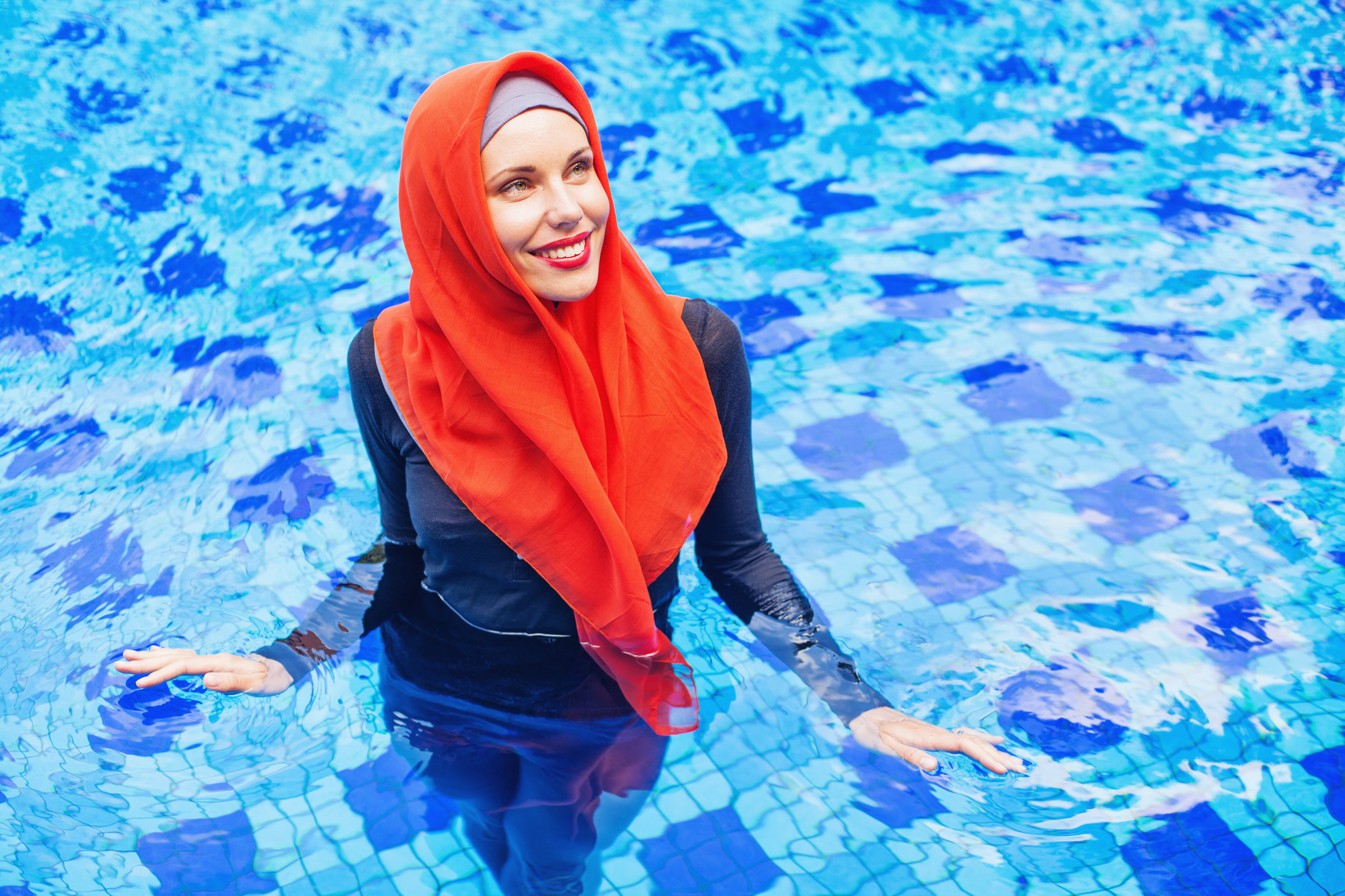 Image of a woman swimming in a burkini.