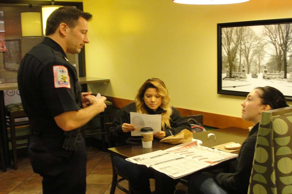 Students talk with Illinois State University Police Chief Aaron Woodruff during Coffee with a Cop.