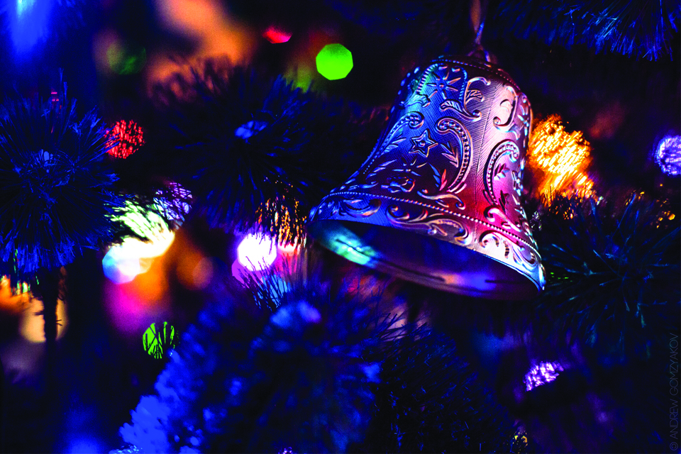 bell in lit tree