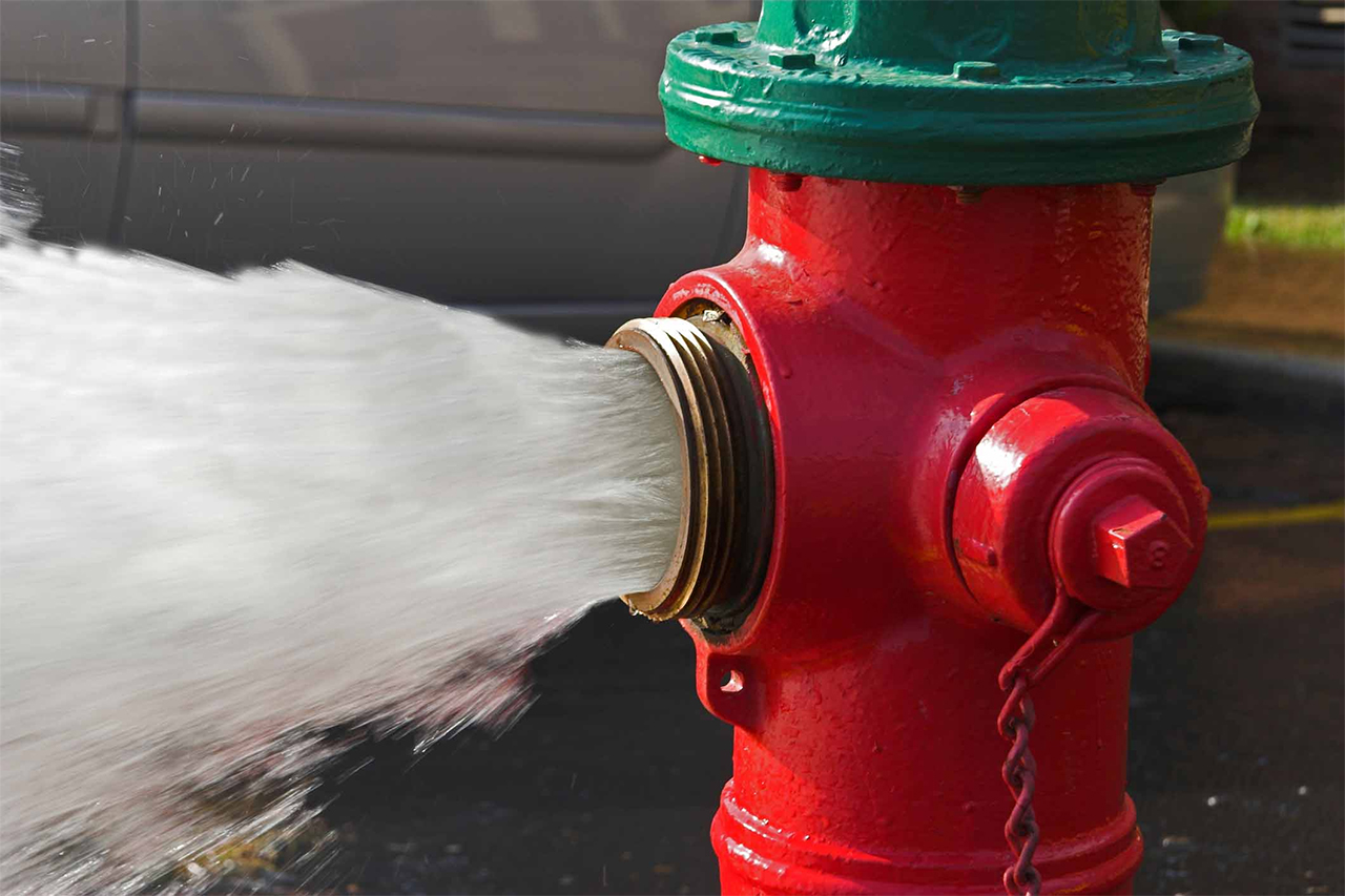 image of a fire hydrant gushing water