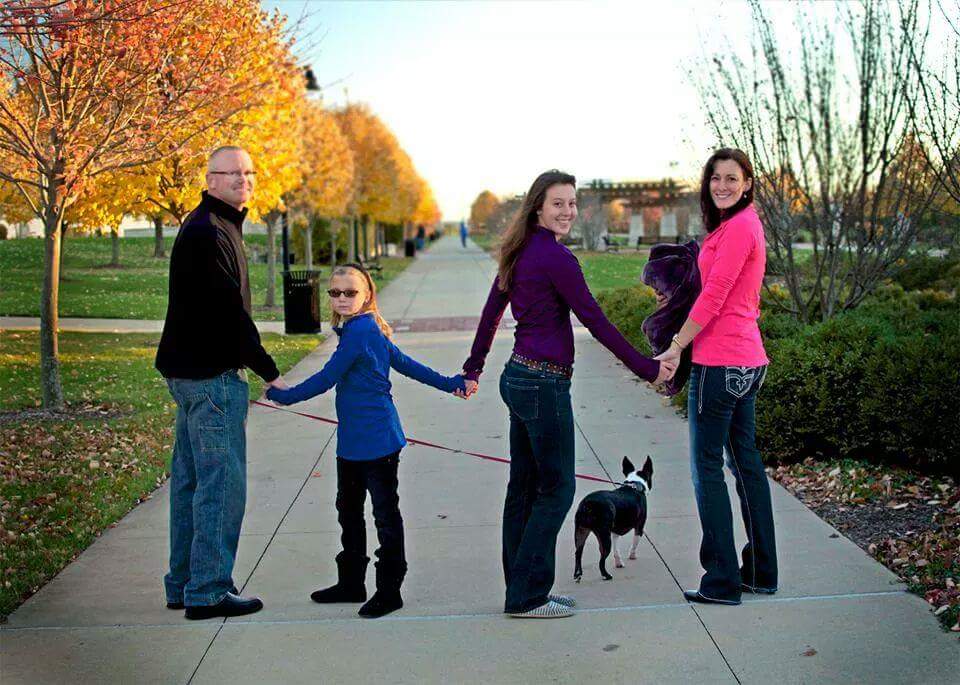 Erin Kennedy (right) with her family. From left to right, her husband, Steve, and daughters, Reagan and Cheyenne, and family dog Ziva.