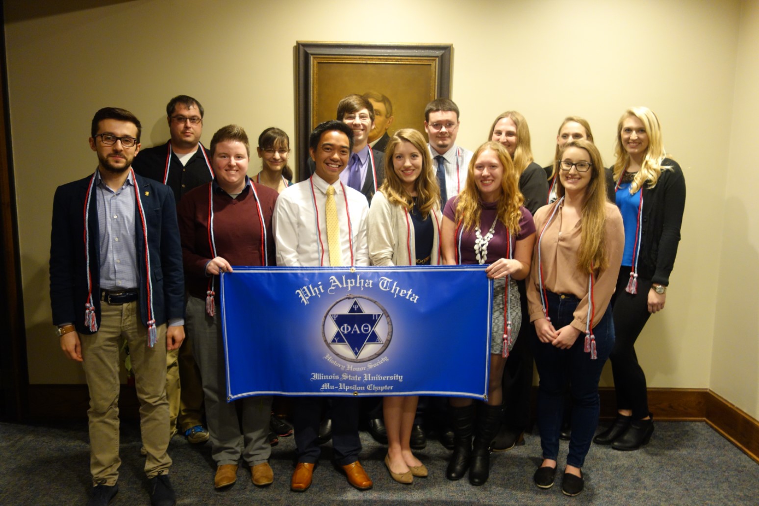 New inductees for Phi Alpha Theta for the fall semester with the PAT banner