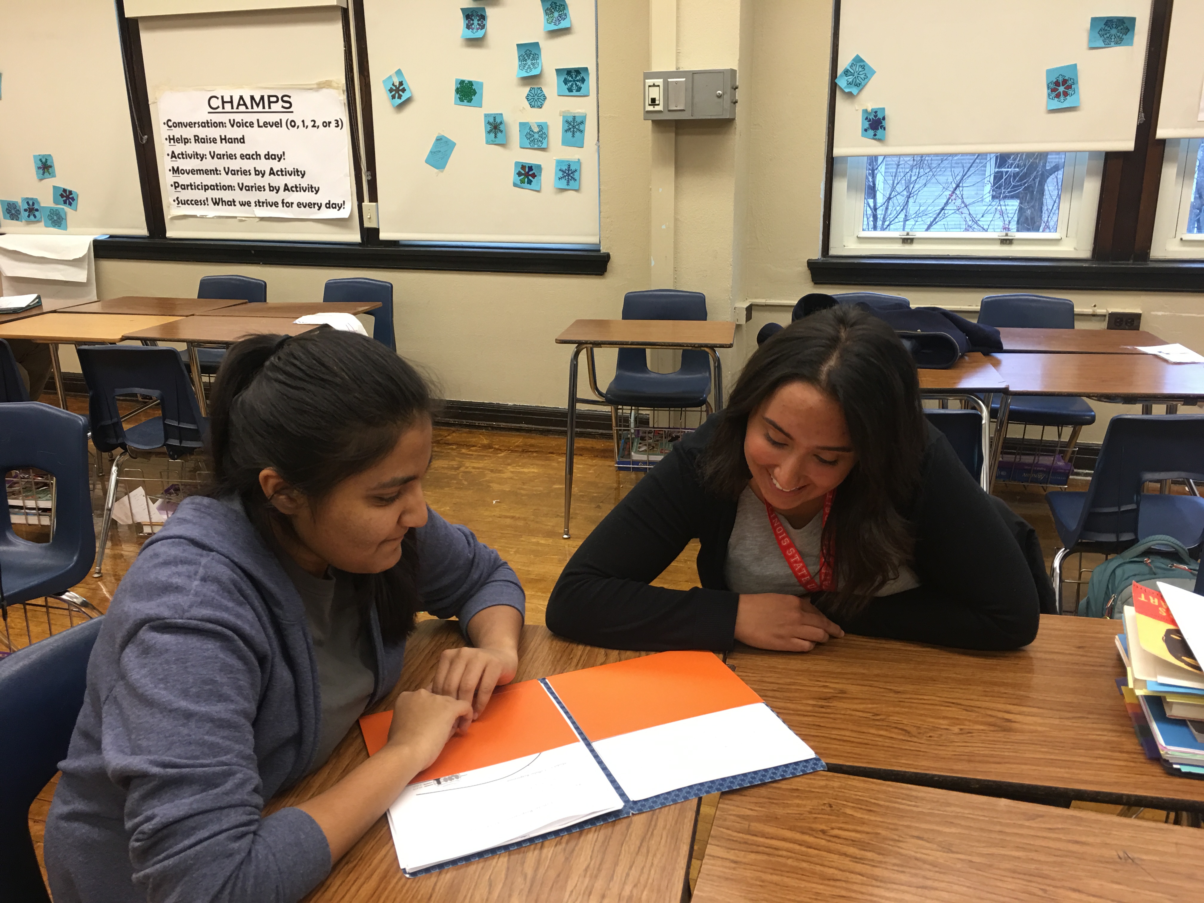 Alexa Leyba works with a student