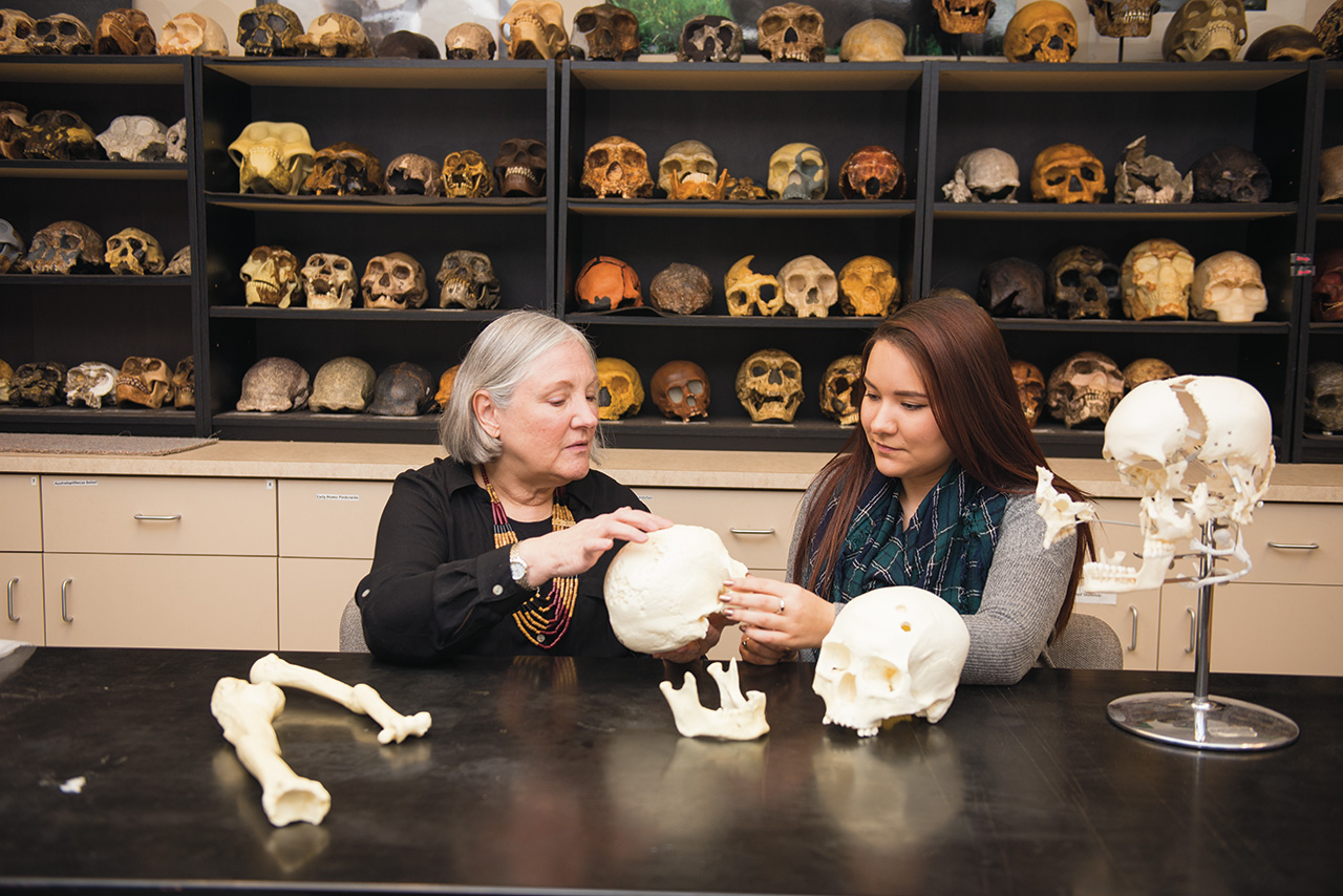 Anthropology Professor Maria Smith is working with students like Katharine Woollen to study remains unearthed from the Schroeder Mounds in order to answer questions about a mysterious pre-Columbian people. (Editor’s note: The bones in this photograph are replica skeletal remains.)