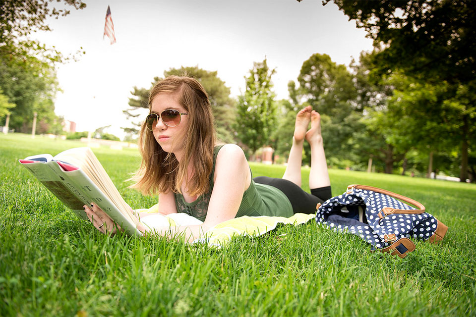 An Illinois State University student takes advantage of the summer weather on the Quad.