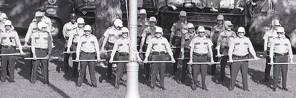 Illinois State Police guard the flagpole on Illinois State's Quad on May 19, 1970