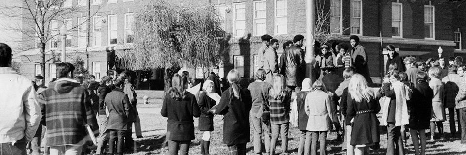 Members of the Black Student Association gathered around the flagpole on December 4, 1969