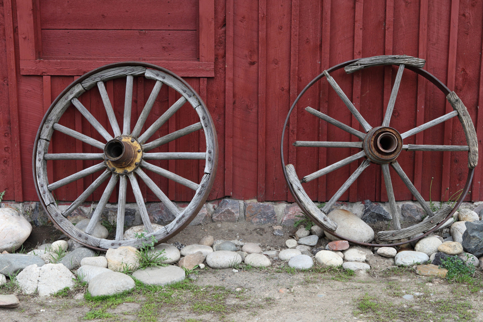 wagon wheels against wall